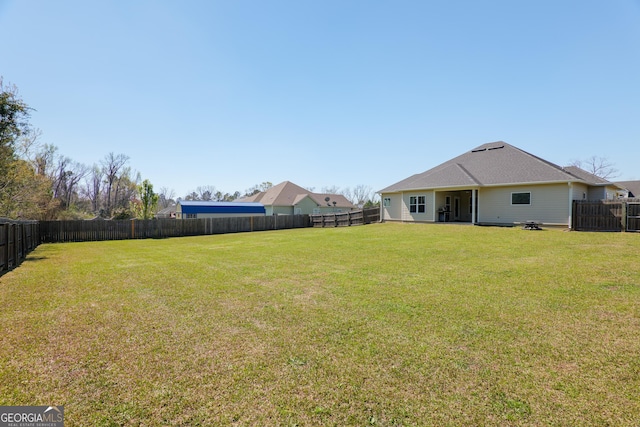 view of yard featuring a fenced backyard