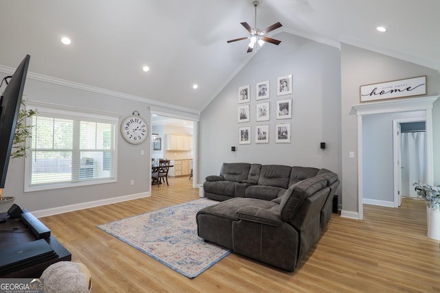 living room featuring baseboards, high vaulted ceiling, recessed lighting, light wood-style floors, and crown molding