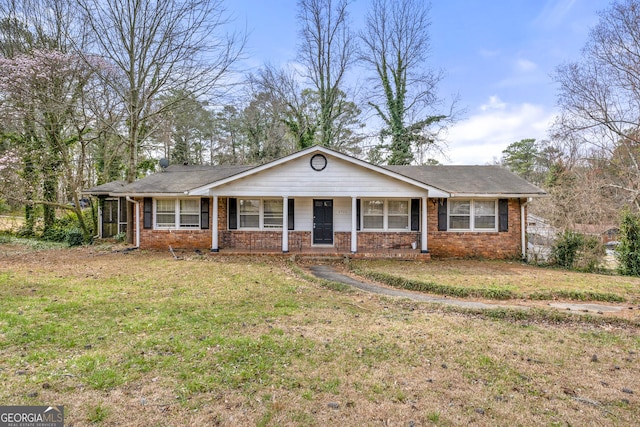 ranch-style house with a front yard, a porch, and brick siding