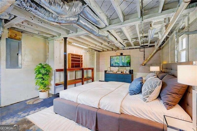 bedroom with multiple windows, electric panel, and unfinished concrete flooring