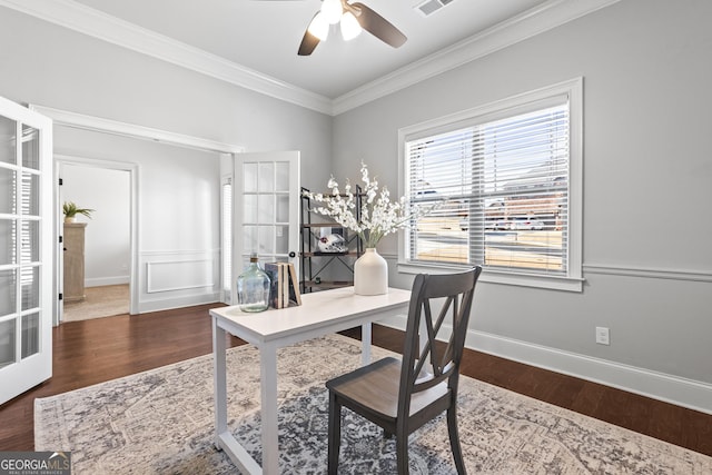 home office featuring crown molding, baseboards, french doors, wood finished floors, and a ceiling fan