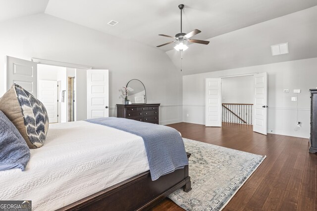 bedroom with visible vents, lofted ceiling, a ceiling fan, and dark wood-style flooring