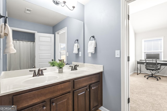 full bath featuring plenty of natural light, visible vents, and a sink