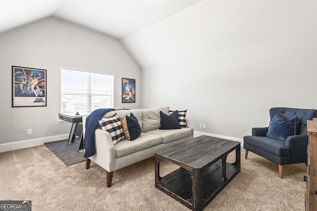 living room featuring carpet flooring, baseboards, and vaulted ceiling