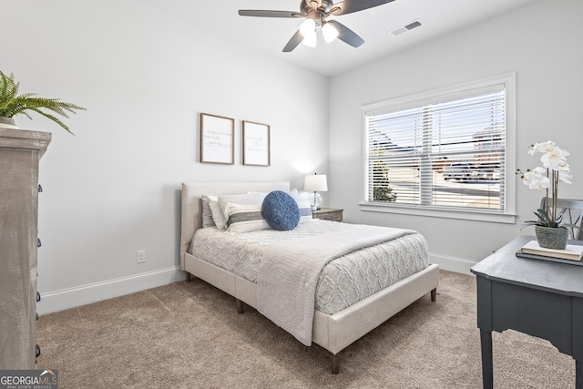 bedroom featuring visible vents, carpet floors, baseboards, and a ceiling fan