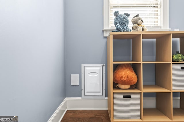 room details featuring wood finished floors and baseboards