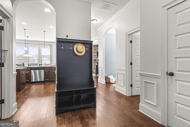 interior space with visible vents, recessed lighting, a sink, and wood-type flooring