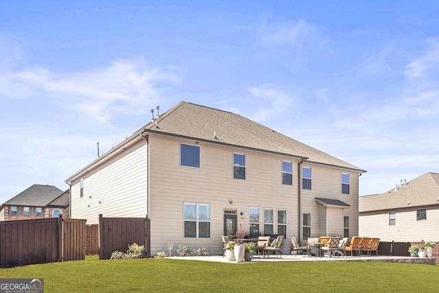 back of house with a lawn, outdoor lounge area, a patio, and fence