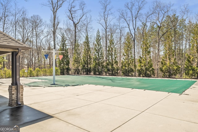 view of pool featuring a patio area, fence, and a fenced in pool