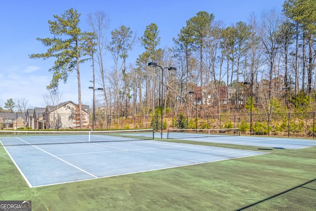 view of sport court with community basketball court and fence