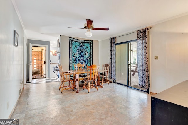 dining area featuring a ceiling fan and ornamental molding