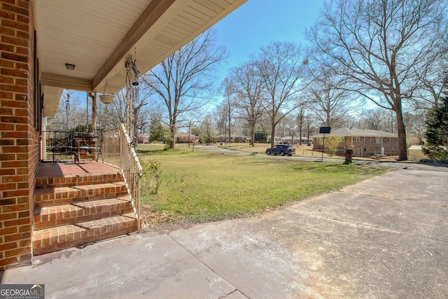 view of yard featuring covered porch