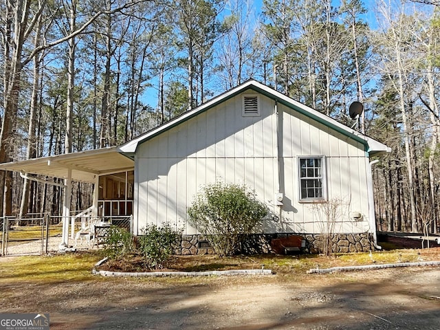 view of home's exterior featuring crawl space and a sunroom