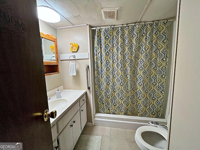 full bath featuring tile patterned flooring, visible vents, curtained shower, vanity, and a textured ceiling