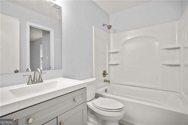 full bathroom featuring vanity, toilet, bathtub / shower combination, and visible vents