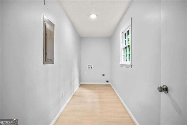 interior space with light wood-style flooring and baseboards