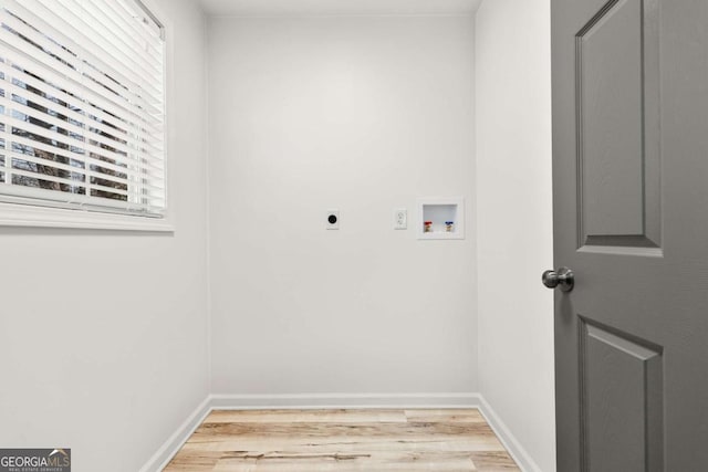 laundry room with wood finished floors, baseboards, laundry area, electric dryer hookup, and washer hookup