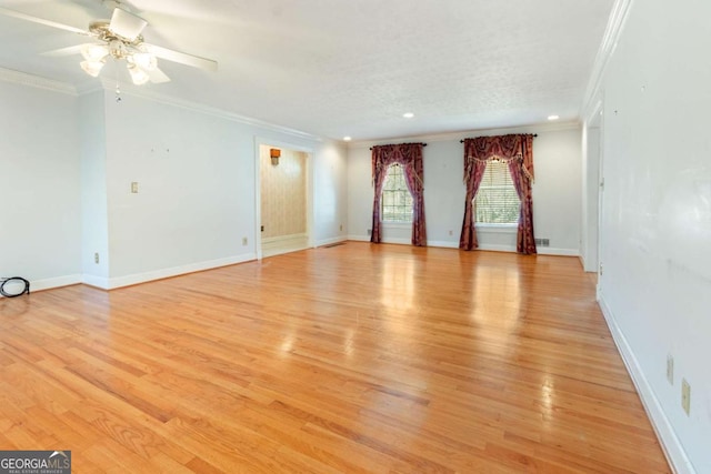 unfurnished room with a ceiling fan, baseboards, recessed lighting, ornamental molding, and light wood-style floors