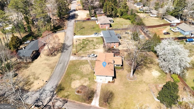 birds eye view of property with a residential view