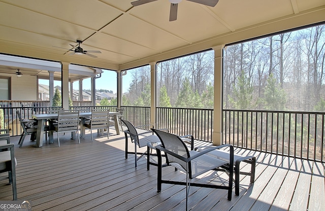 sunroom featuring a ceiling fan