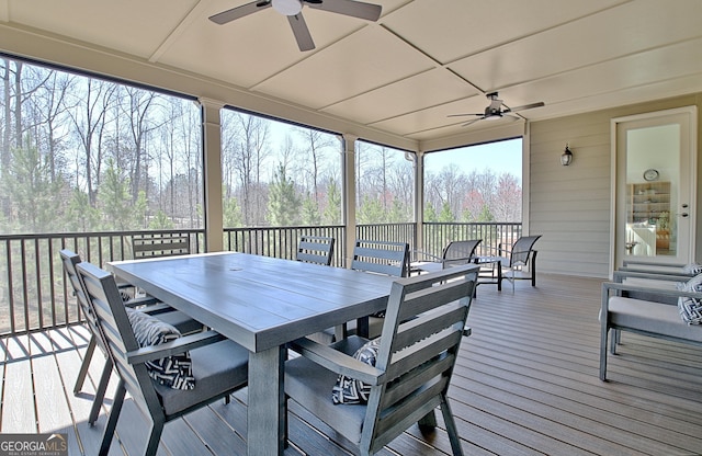 sunroom / solarium featuring a ceiling fan