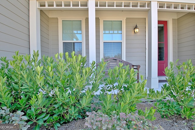 view of exterior entry with covered porch