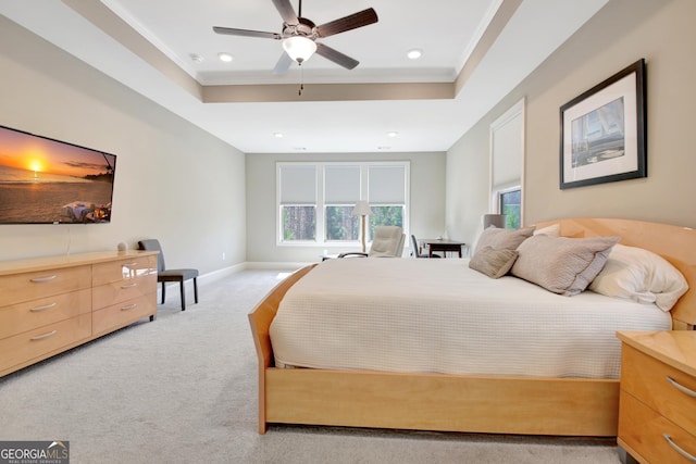 bedroom featuring recessed lighting, baseboards, a raised ceiling, and light colored carpet