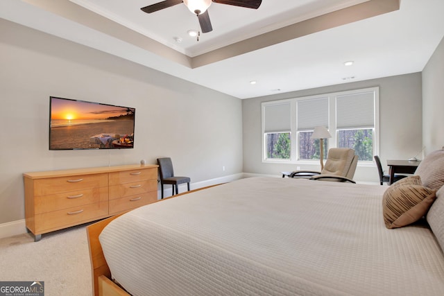 bedroom with a ceiling fan, recessed lighting, crown molding, baseboards, and light colored carpet