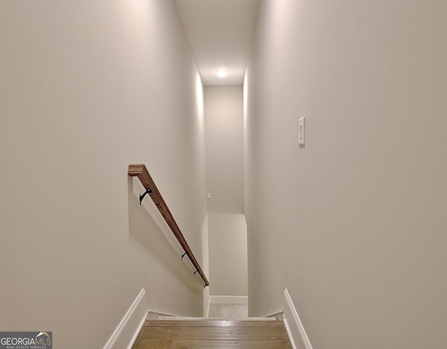 stairs with wood finished floors