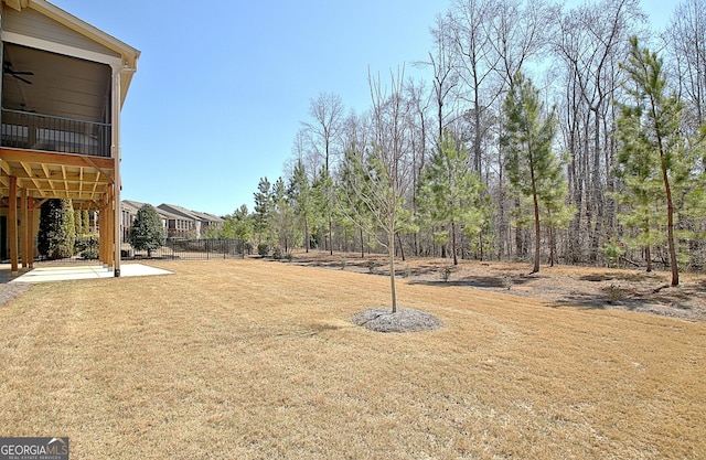 view of yard featuring a patio and fence