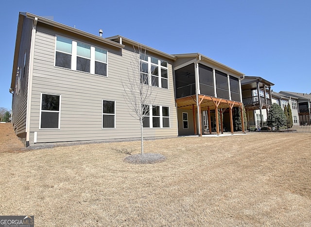 back of house with a patio, fence, and a sunroom