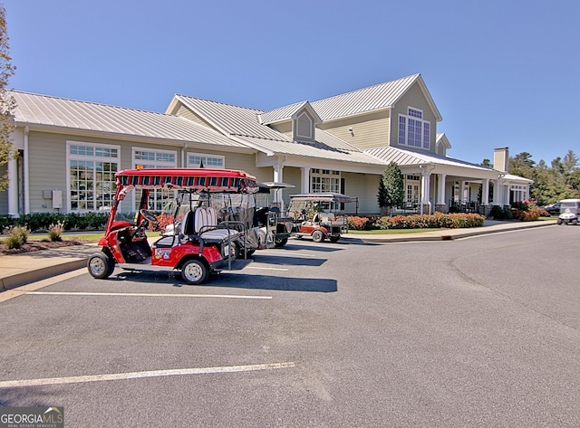 view of building exterior featuring uncovered parking