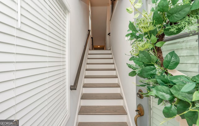 stairway featuring baseboards