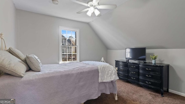 carpeted bedroom with vaulted ceiling, a ceiling fan, and baseboards