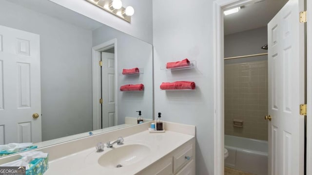 bathroom featuring vanity,  shower combination, and toilet