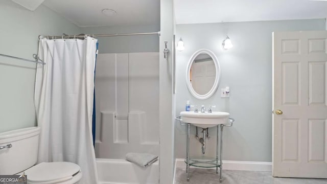 bathroom featuring toilet, shower / bathtub combination with curtain, baseboards, and a sink