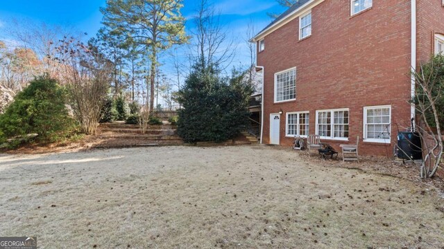 view of side of property featuring brick siding