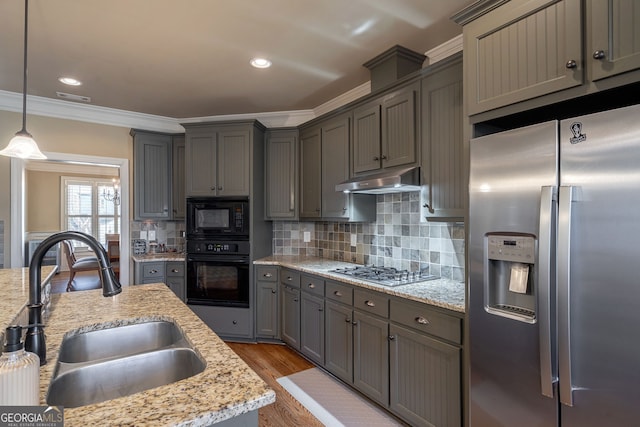 kitchen with visible vents, under cabinet range hood, gray cabinets, black appliances, and a sink