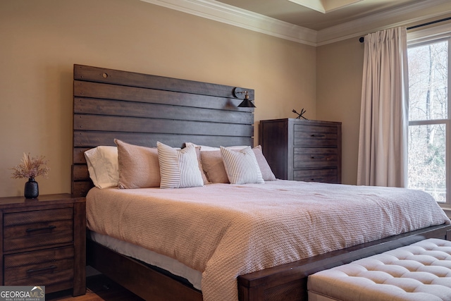 bedroom with crown molding