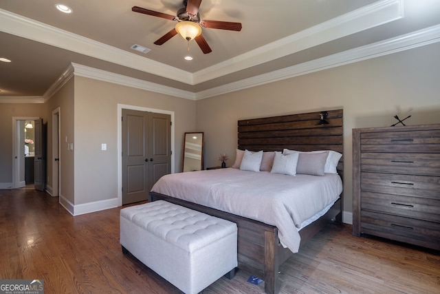 bedroom with wood finished floors, visible vents, baseboards, recessed lighting, and crown molding