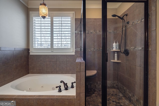 full bathroom featuring a shower stall, a jetted tub, and ornamental molding