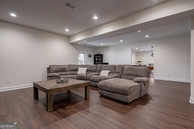 living room featuring dark wood finished floors, recessed lighting, visible vents, and baseboards