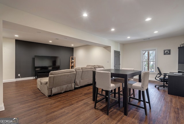 dining space featuring recessed lighting, dark wood-type flooring, and baseboards