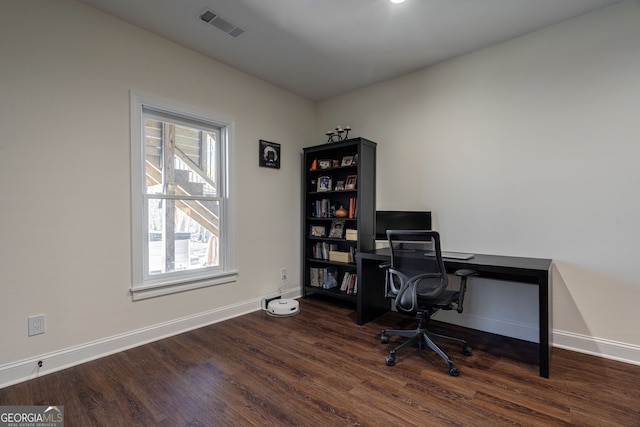 office area featuring visible vents, baseboards, and wood finished floors