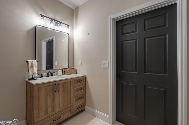 bathroom featuring vanity and baseboards