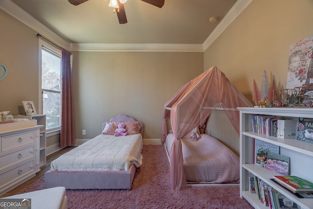 bedroom with baseboards, ornamental molding, and a ceiling fan