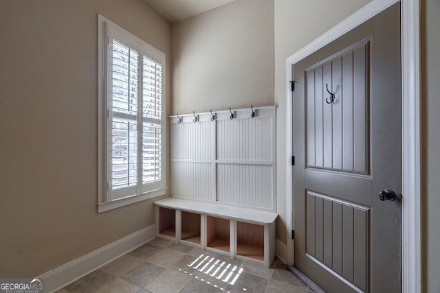 mudroom with a healthy amount of sunlight and baseboards