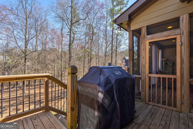 wooden deck with grilling area