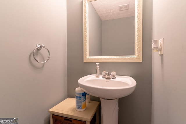 bathroom with a textured ceiling