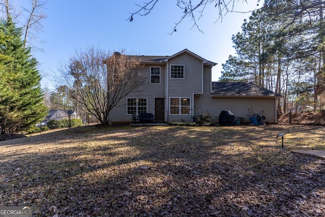 rear view of house with fence